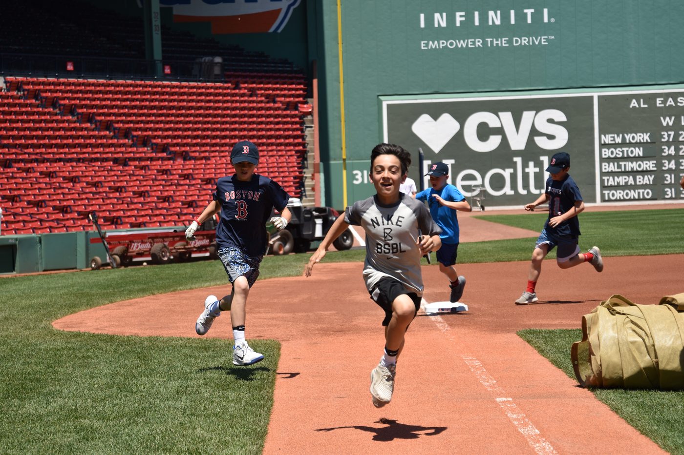 Kids running the bases at Fenway Park