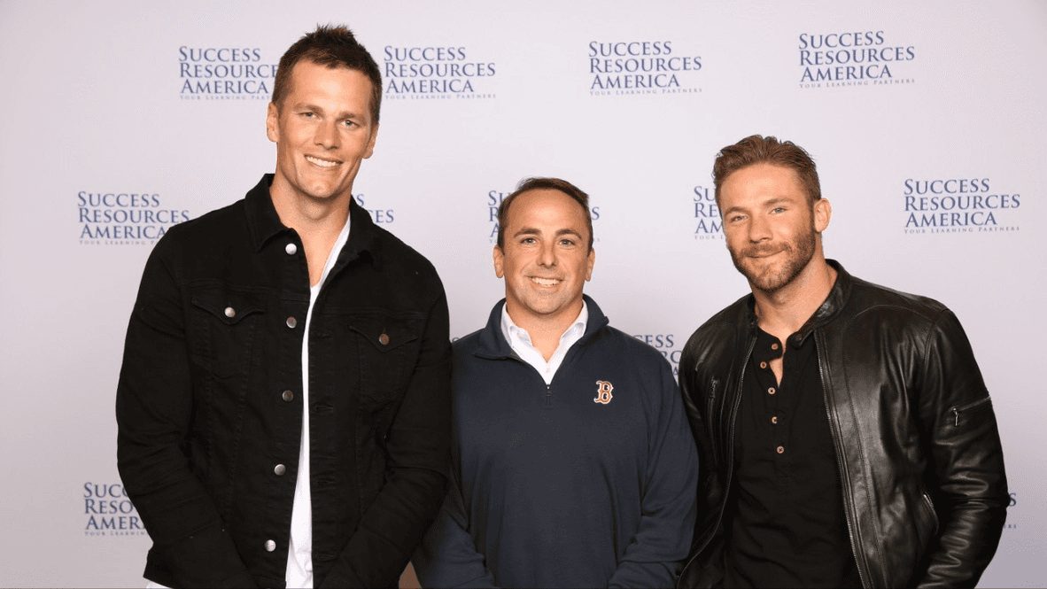 Peter with two guests at a charity event