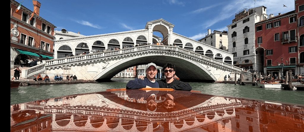 Peter on a water taxi under the Rialto Bridge in Venice